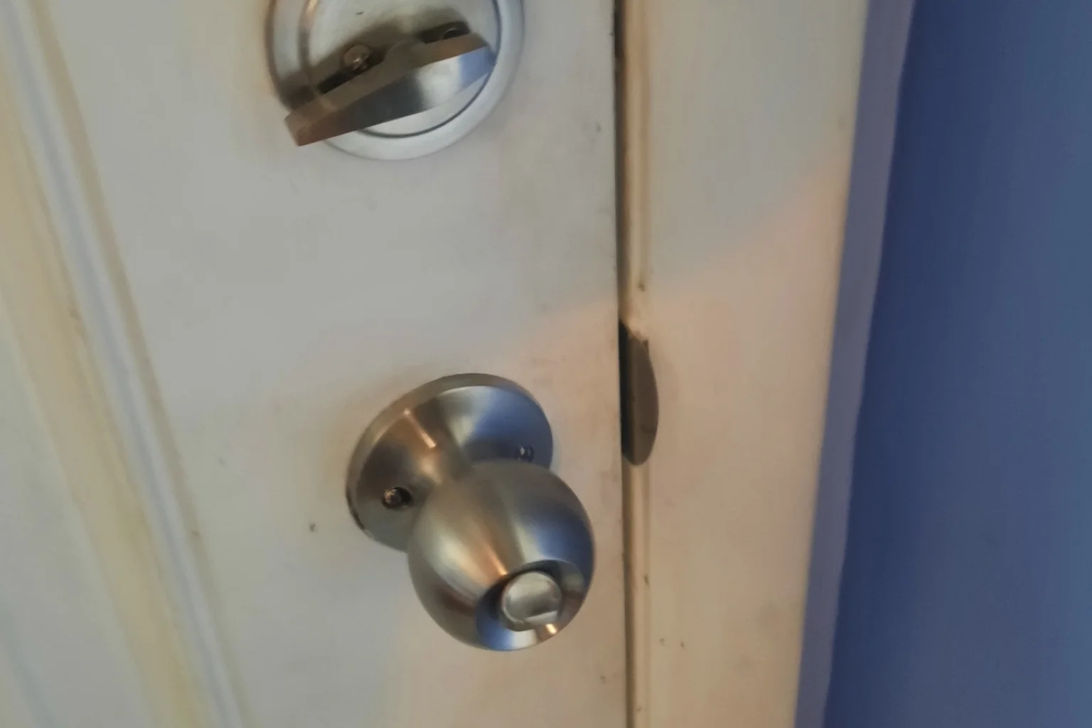 Brushed nickel door knob and deadbolt installation